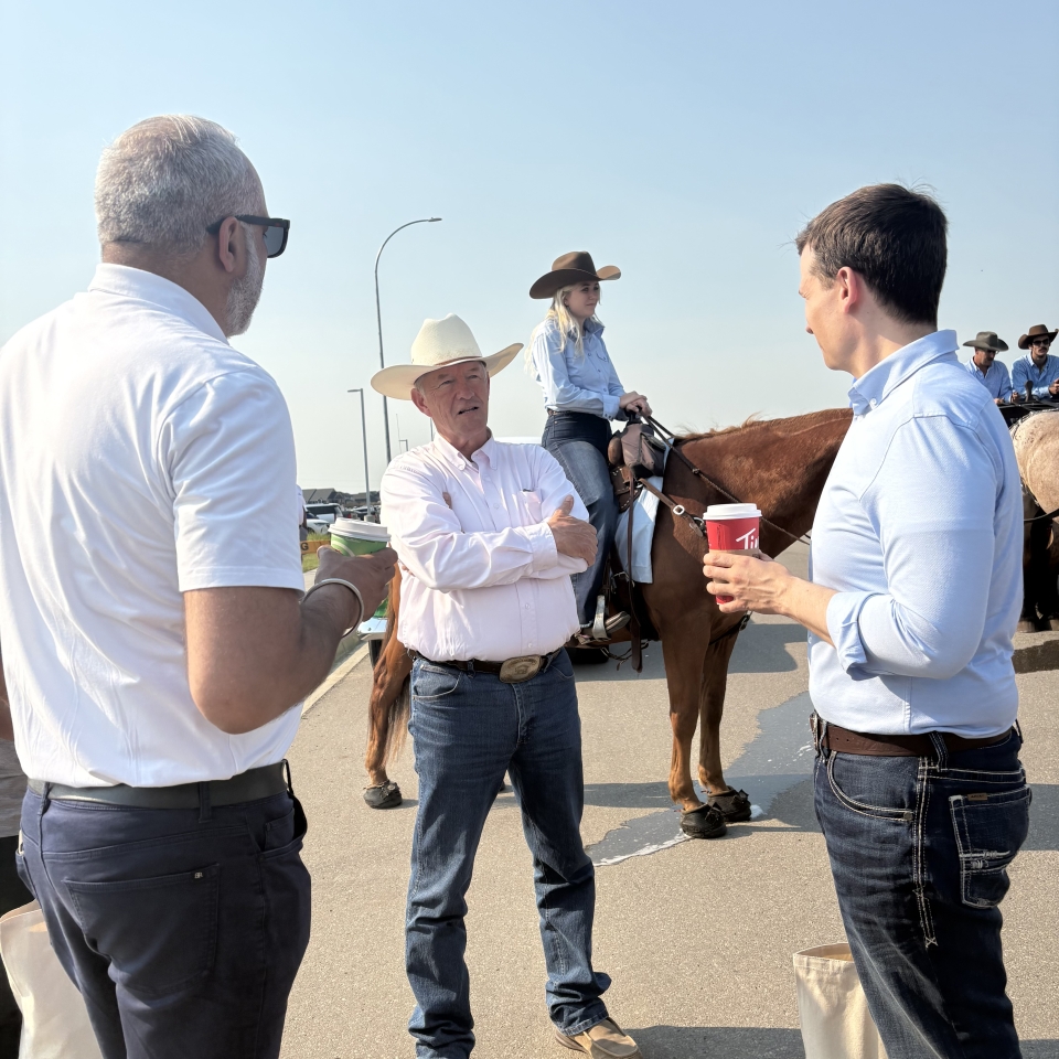 Reeve Samra chats with Calgary Mayor Jeromy Farkas and Bow River MP David Bexte.