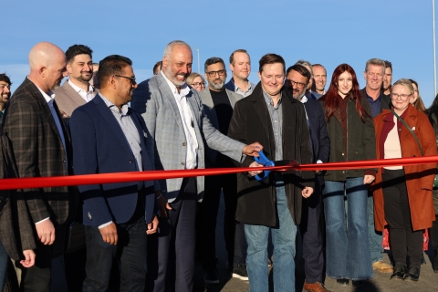 Cutting the ribbon on the Stage 2 interchange at Airport Trail and Stoney Trail NE.